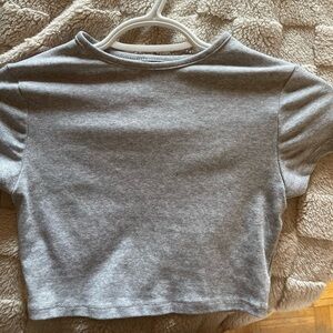 Two grey tops. One long sleeve and the other cropped
